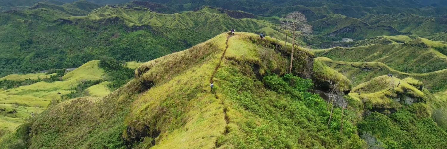 Mt. Megatong Sto. Tomas Davao del Norte hiking at grasslands with beautiful background ridges. Visited by Manakaay ug Bukid.