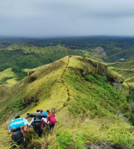 Mt. Megatong Sto. Tomas Davao del Norte hiking at grasslands with beautiful background ridges. Visited by Manakaay ug Bukid.