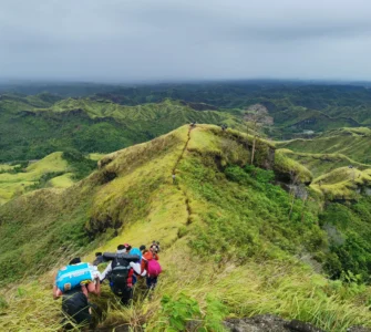 Mt. Megatong Sto. Tomas Davao del Norte hiking at grasslands with beautiful background ridges. Visited by Manakaay ug Bukid.