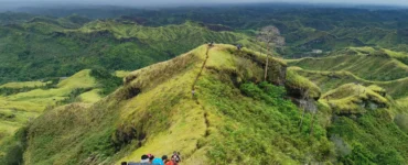 Mt. Megatong Sto. Tomas Davao del Norte hiking at grasslands with beautiful background ridges. Visited by Manakaay ug Bukid.