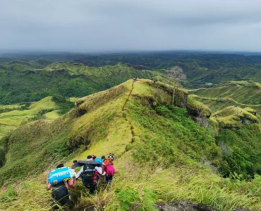Mt. Megatong Sto. Tomas Davao del Norte hiking at grasslands with beautiful background ridges. Visited by Manakaay ug Bukid.