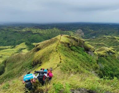 Mt. Megatong Sto. Tomas Davao del Norte hiking at grasslands with beautiful background ridges. Visited by Manakaay ug Bukid.