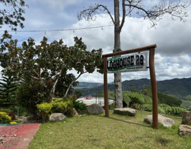 loghouse 28 mountain resort kitaotao bukidnon signage with landscape view