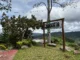 loghouse 28 mountain resort kitaotao bukidnon signage with landscape view