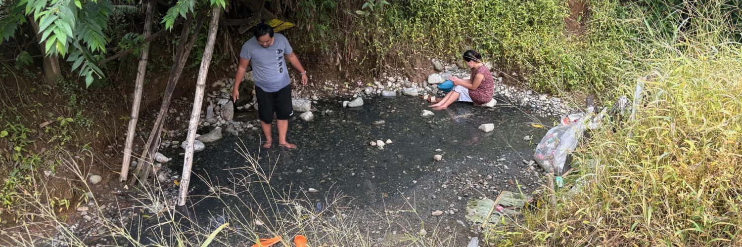 Bukal sa Kanal Natural Hot Springs Purok Mainit Maragusan dark pebbles stones where small hot springs from.