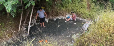 Bukal sa Kanal Natural Hot Springs Purok Mainit Maragusan dark pebbles stones where small hot springs from.