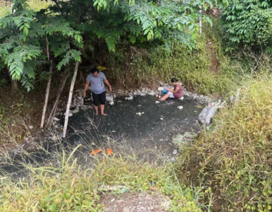 Bukal sa Kanal Natural Hot Springs Purok Mainit Maragusan dark pebbles stones where small hot springs from.