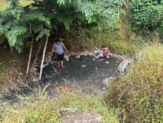 Bukal sa Kanal Natural Hot Springs Purok Mainit Maragusan dark pebbles stones where small hot springs from.