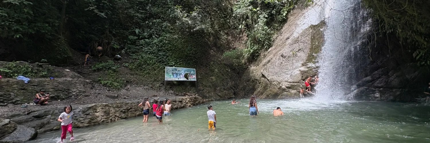 locals swimming in marangig falls maragusan davao de oro