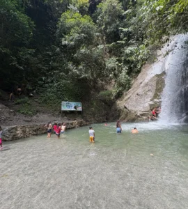 locals swimming in marangig falls maragusan davao de oro