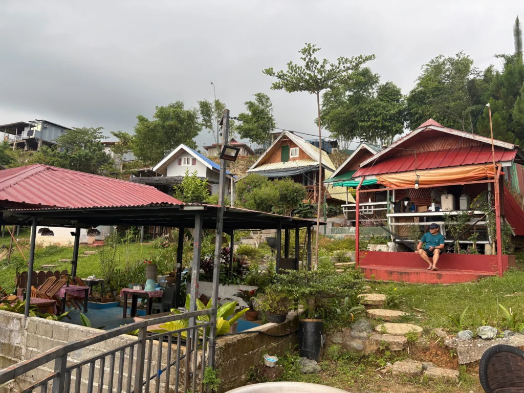 Blue Ridge Campsite Sitio Kabalansihan, Brgy. Sinuda, Kitaotao, Bukidnon the A cottages all facing the landscape.