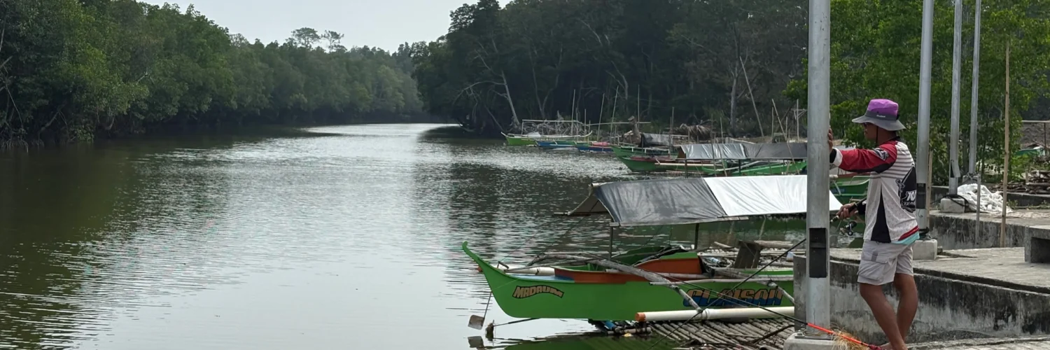 Nabintad River Park in Madaum, Tagum Davao del Norte boat pier and wide river expanse for tour